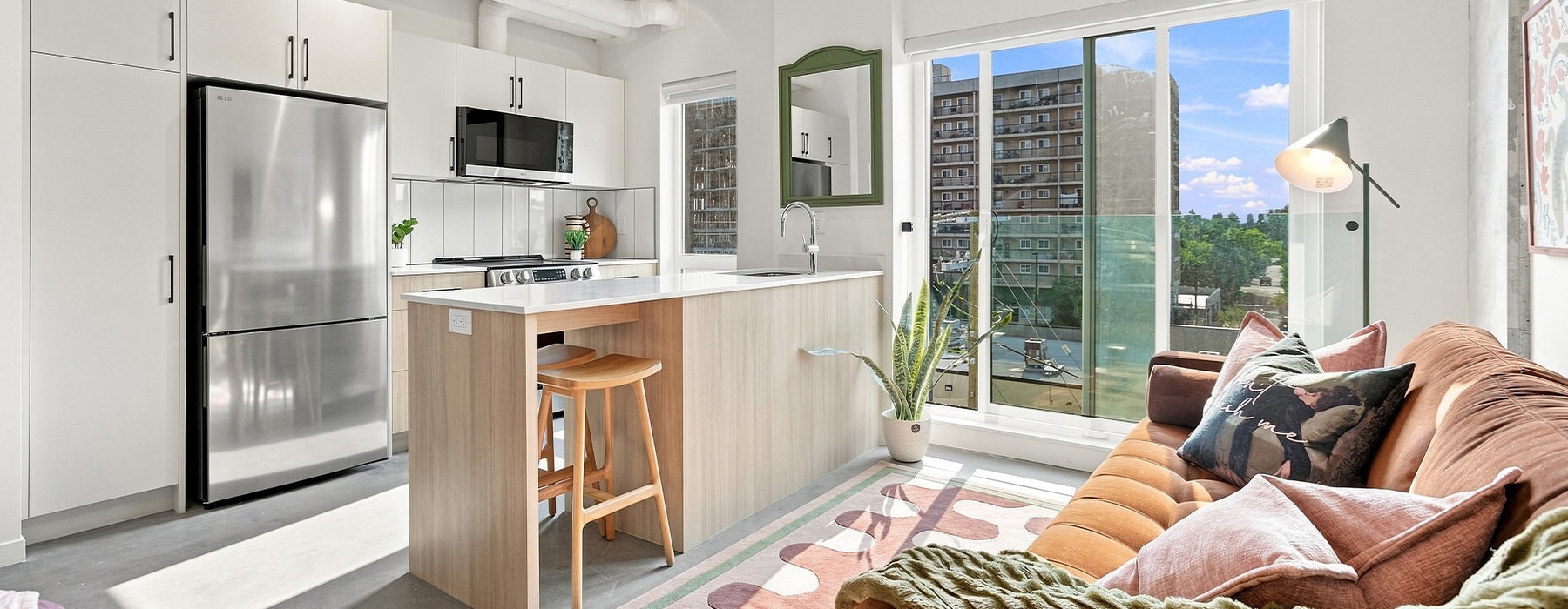 open kitchen and living room with couch and kitchen island