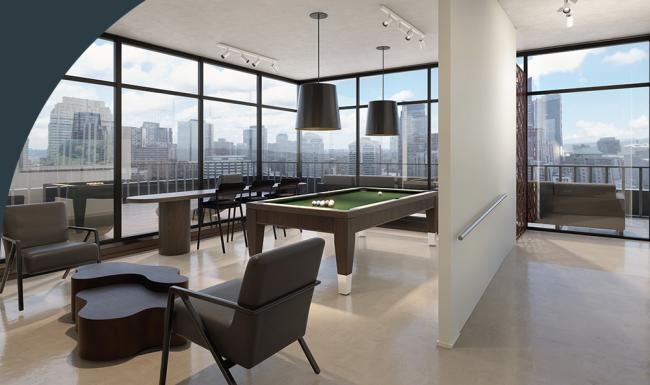a room with a pool table and chairs